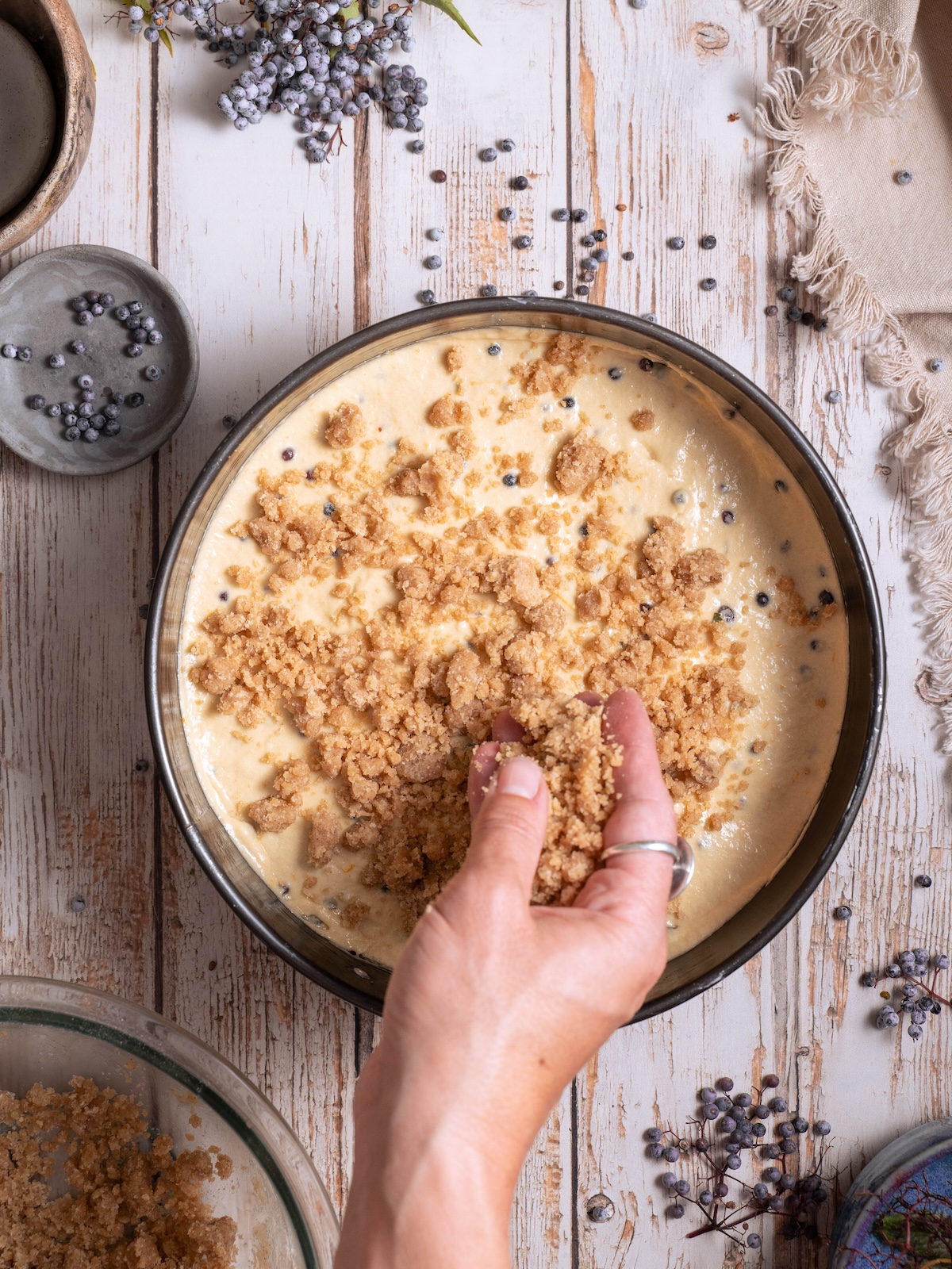 Sprinkling streusel on top of cake batter