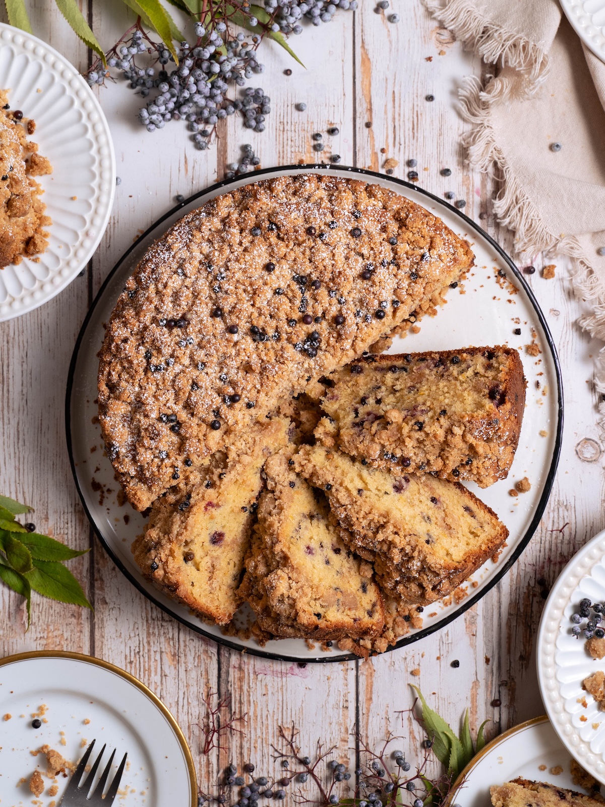 An elderberry coffee cake, cut into slices