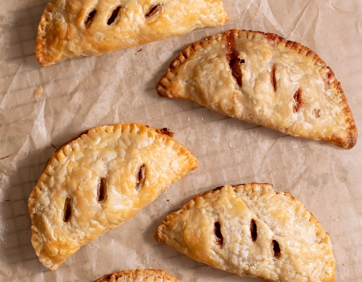 Freshly baked hand pies on a cooling rack
