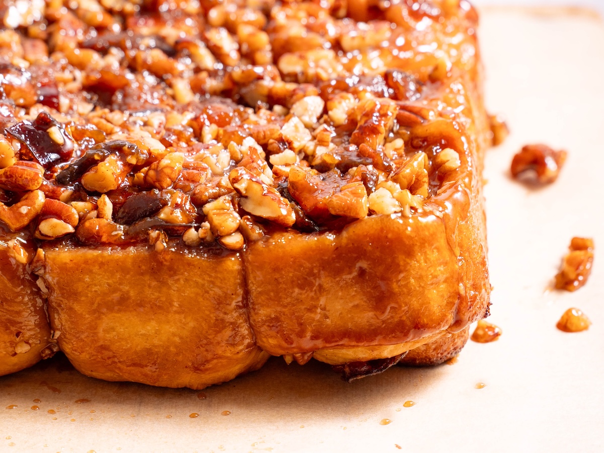 Gooey sticky buns covered in maple caramel and pecans