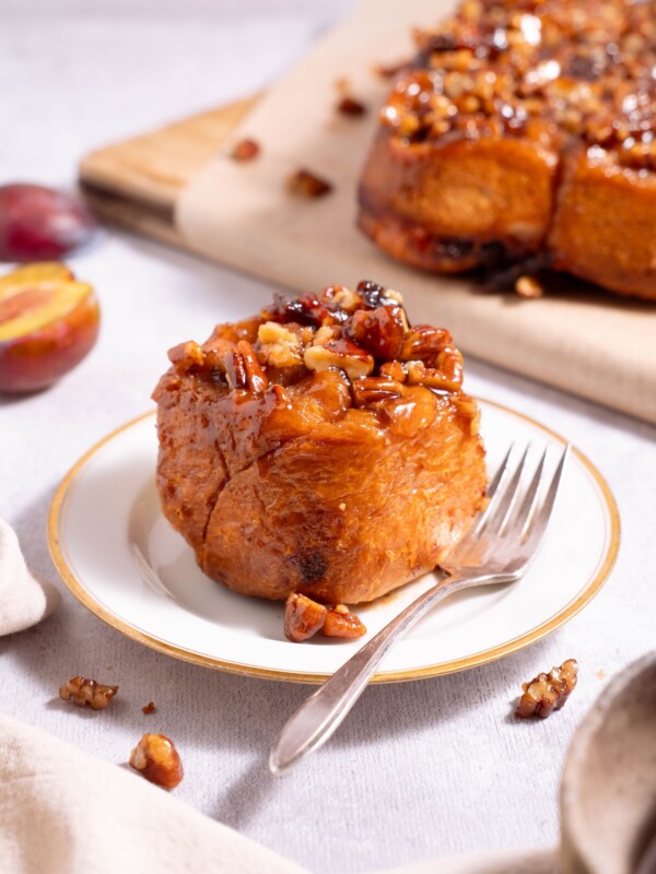 A batch of sticky buns, with one set aside on a plate
