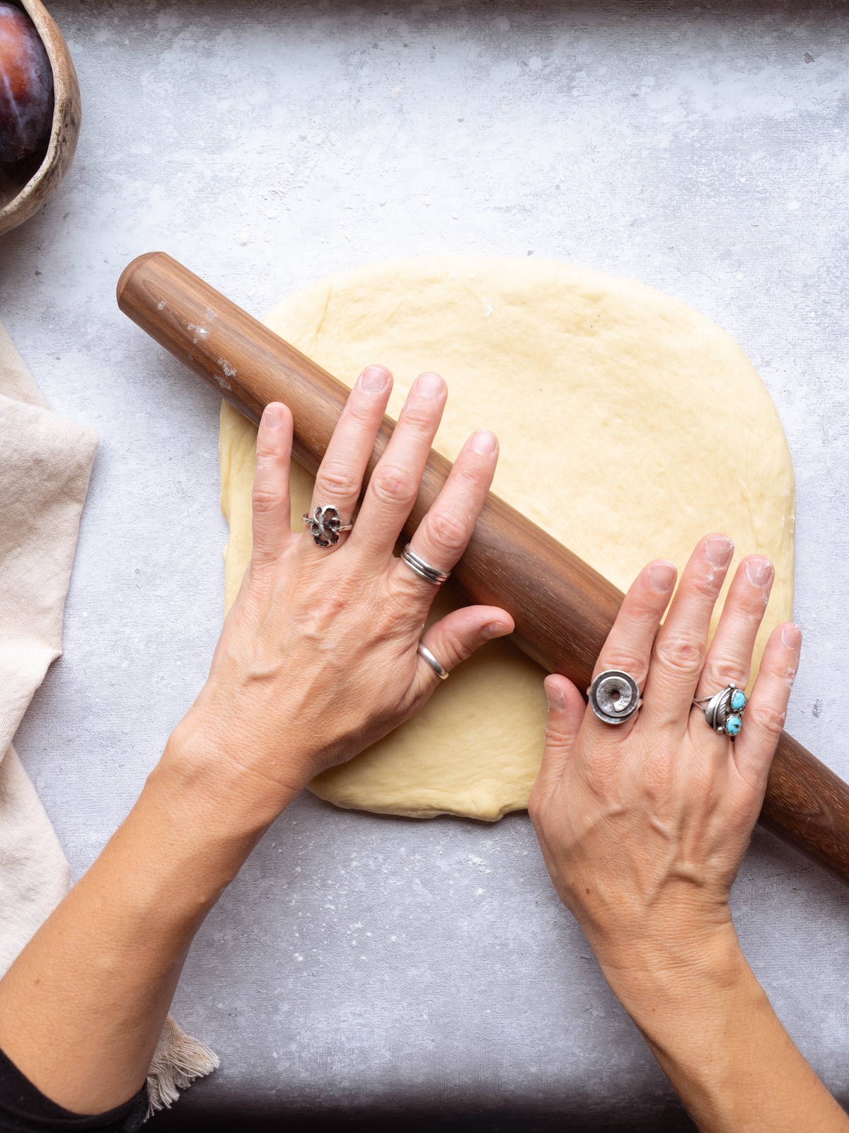 Rolling out cinnamon roll dough