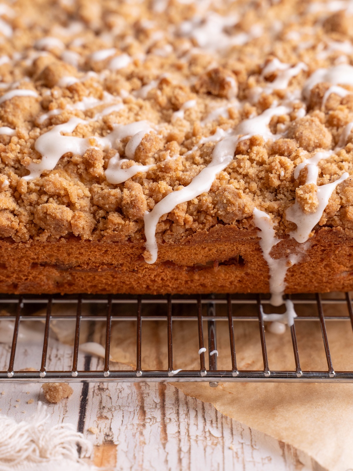 Glaze dripping down the sides of a coffee cake