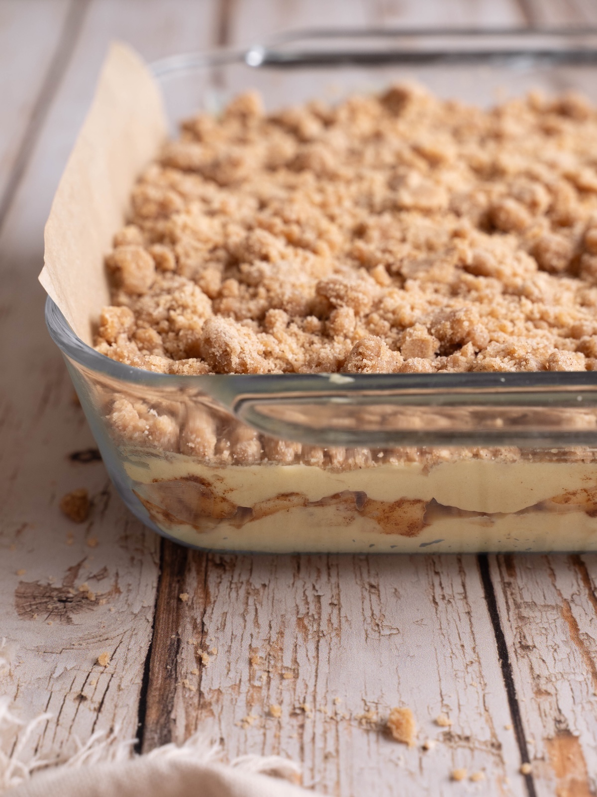 Layers of cake batter and spiced apples before baking