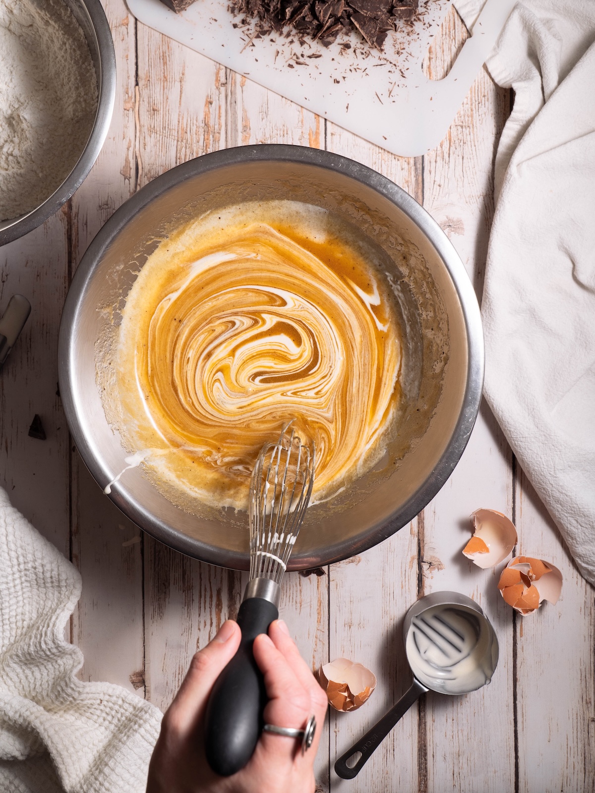 Whisking together brown butter and sourdough starter