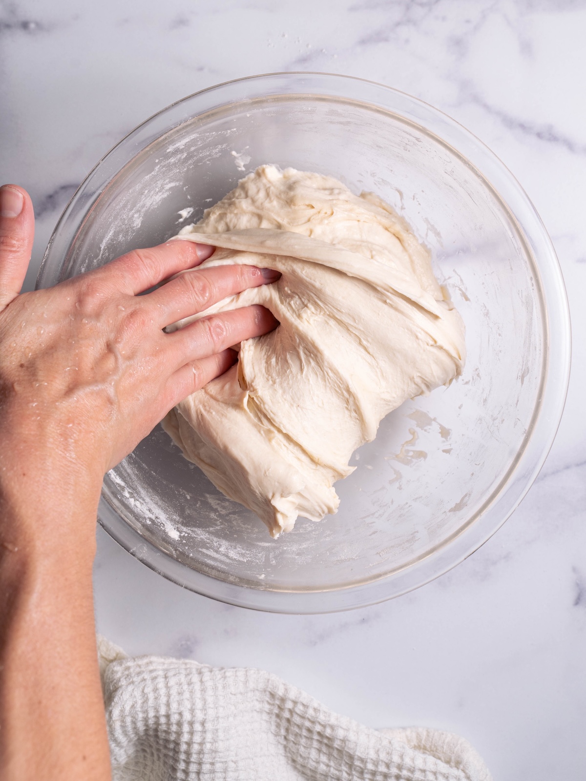 Folding sourdough to build tension