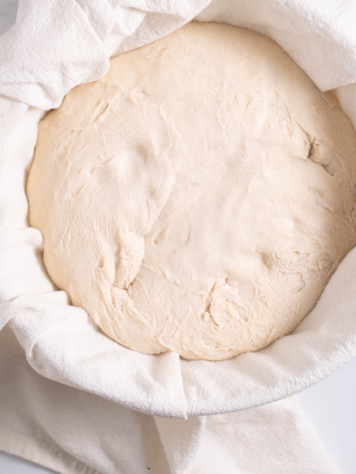 A slight indent left behind in bread dough after doing the "fingertip test"