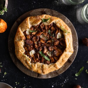 A rustic chanterelle tart on a serving plate