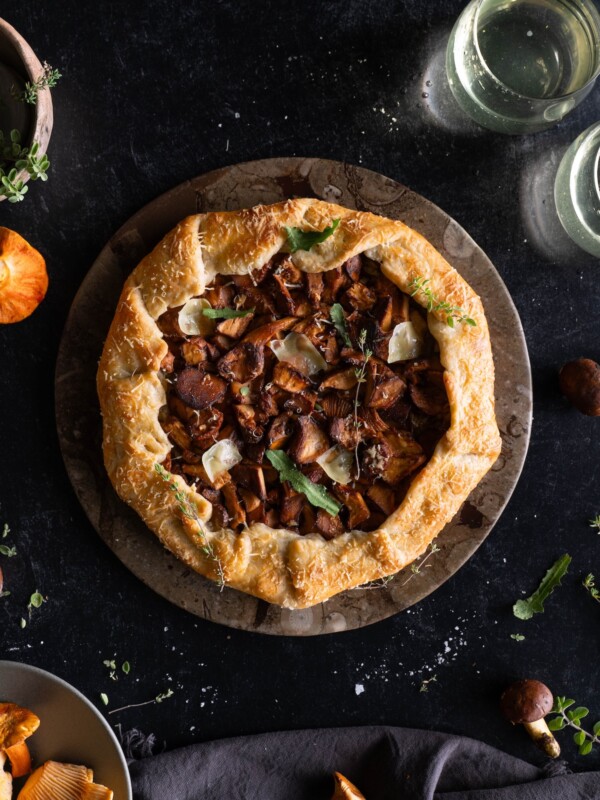A rustic chanterelle tart on a serving plate