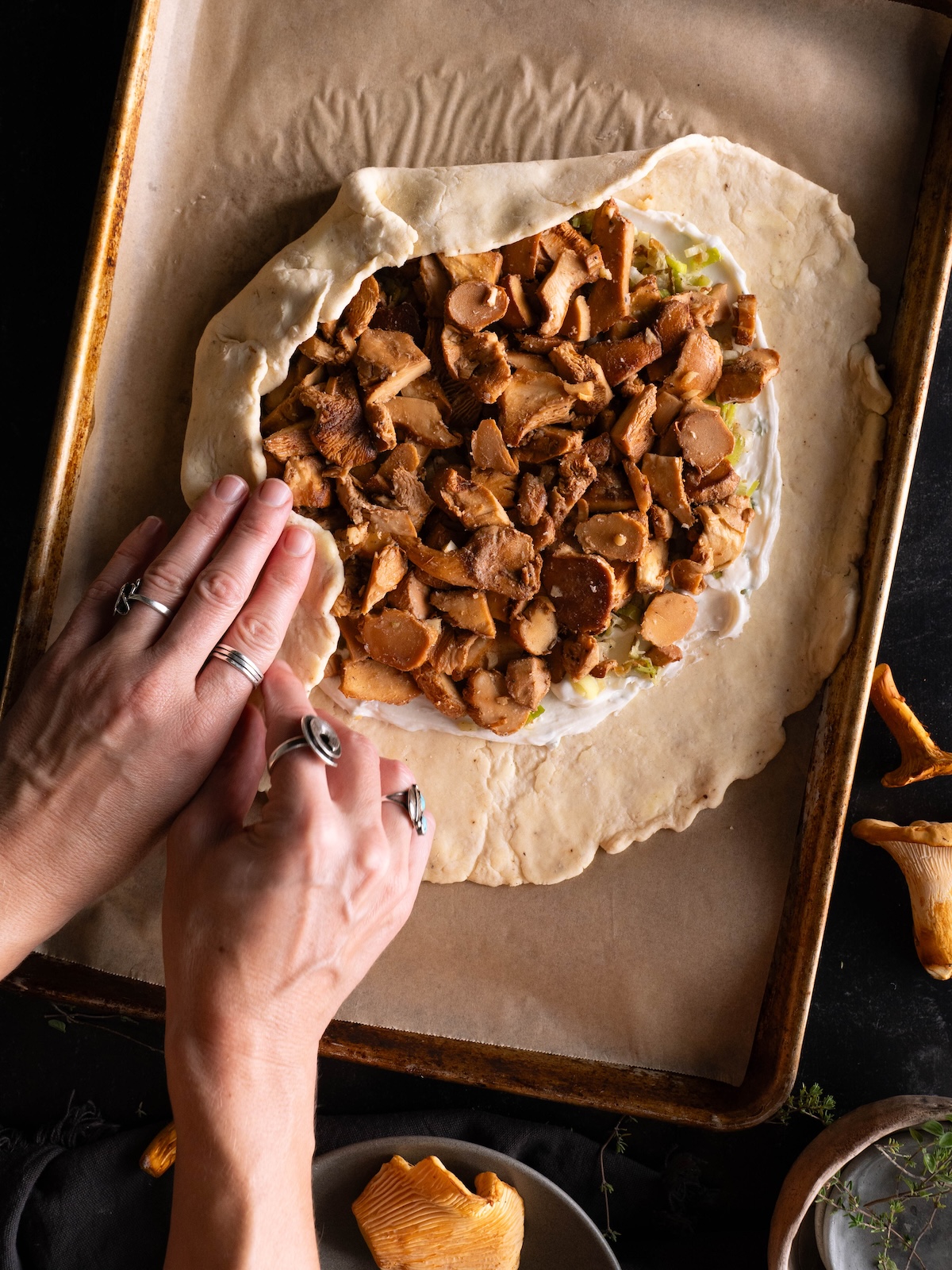 Folding a mushroom galette
