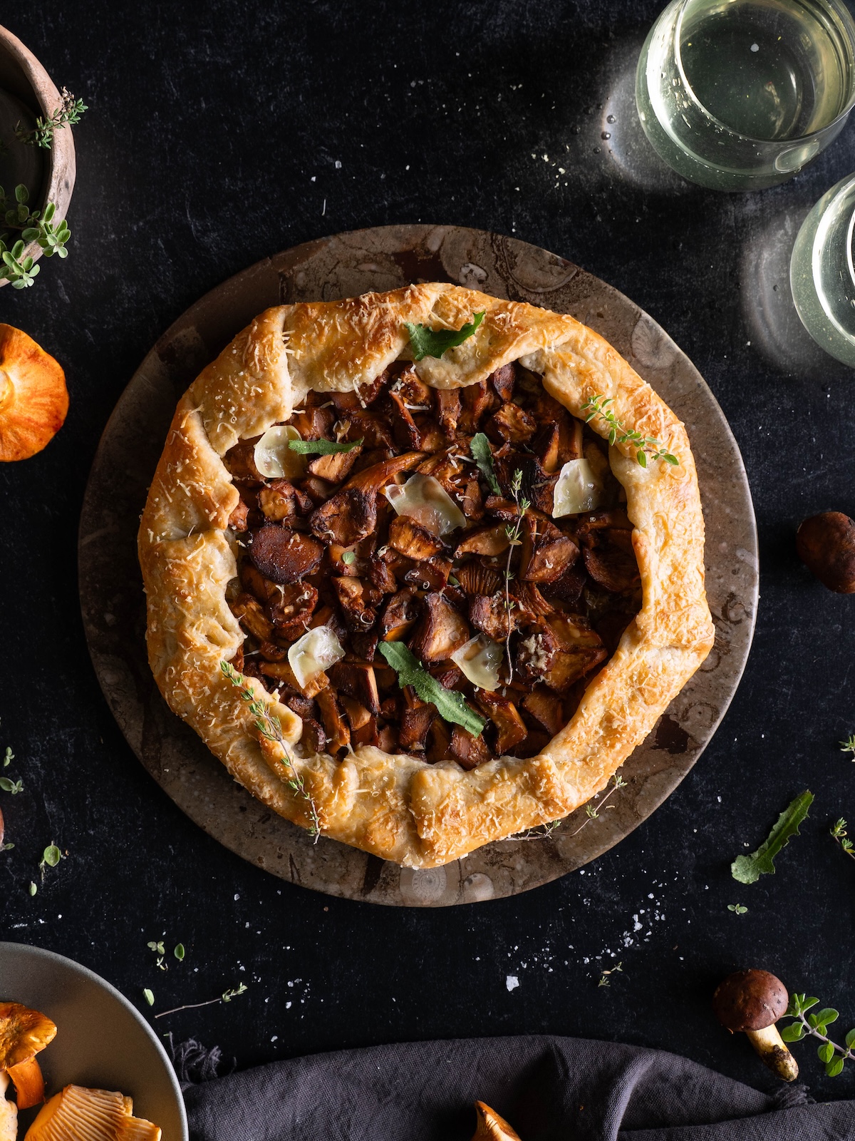 A rustic chanterelle tart on a serving plate