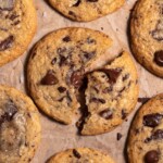 Closeup look at a melty brown butter sourdough chocolate chip cookie, broken in half
