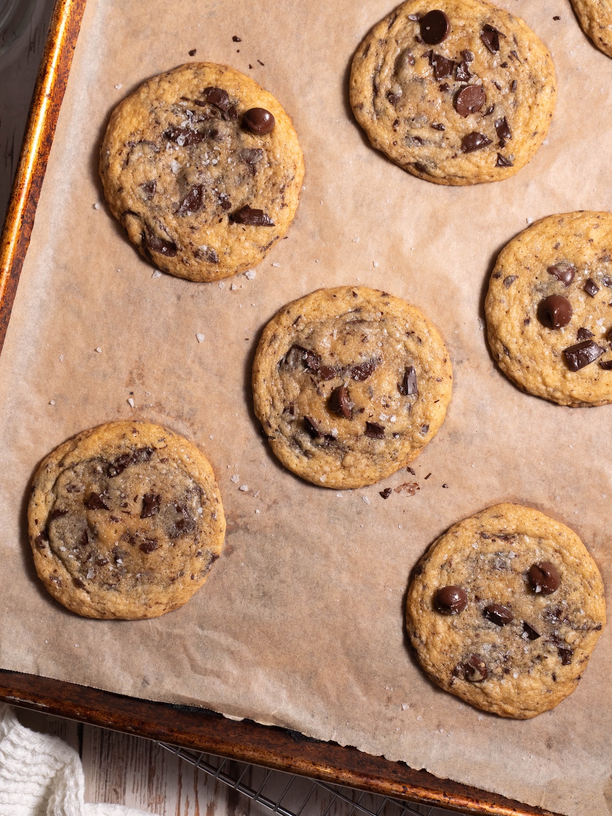 A baking sheet with sourdough chocolate chip cookies, fresh out of the oven