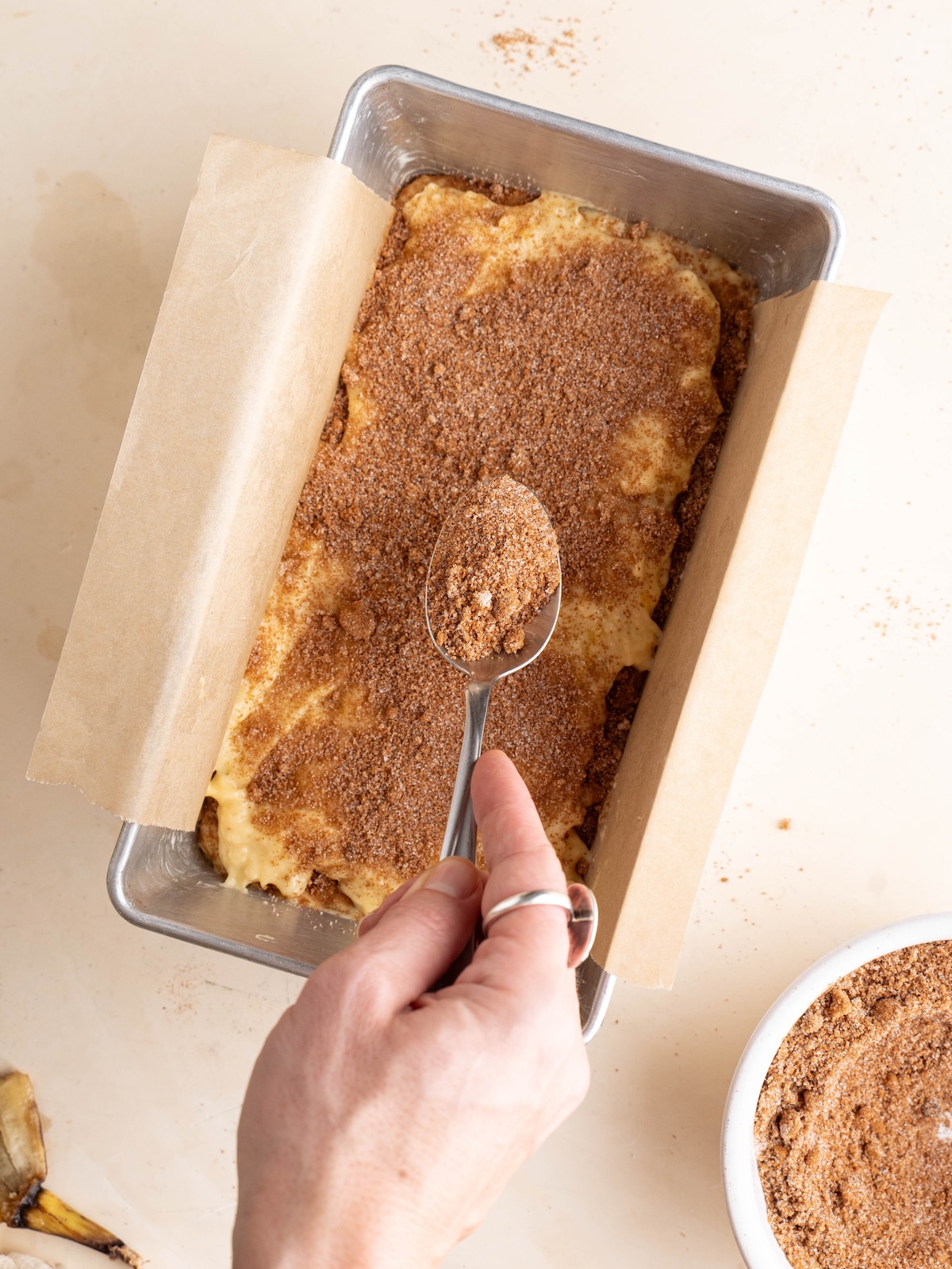 Sprinkling cinnamon sugar layer over batter
