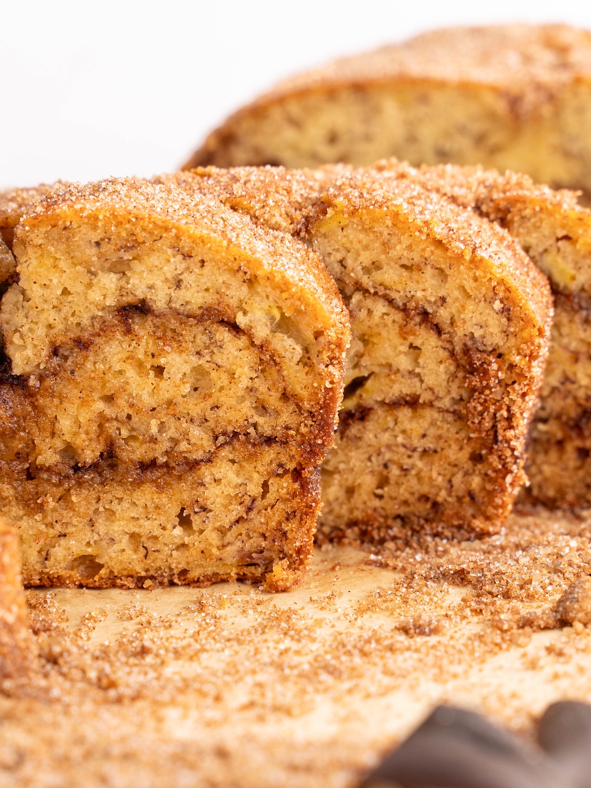 Slices of banana bread with a cinnamon swirl throughout