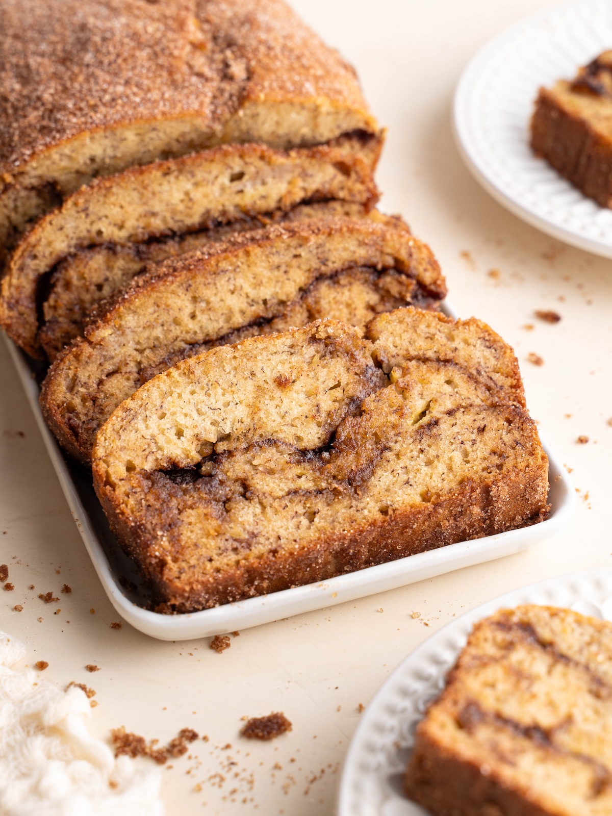 Cinnamon swirl banana bread sliced on plates