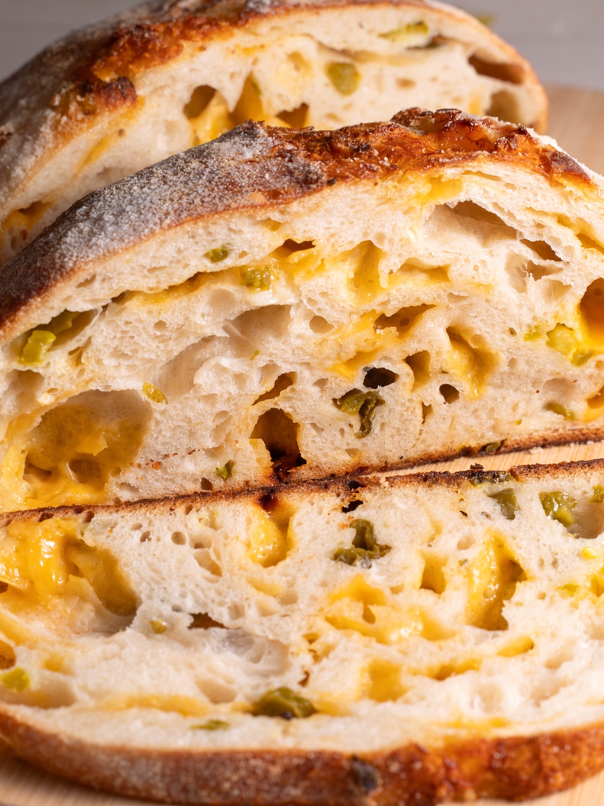 Slices of homemade sourdough filled with jalapeños and cheese