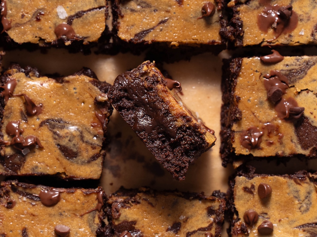 A brownie turned on its side to show fudgy texture