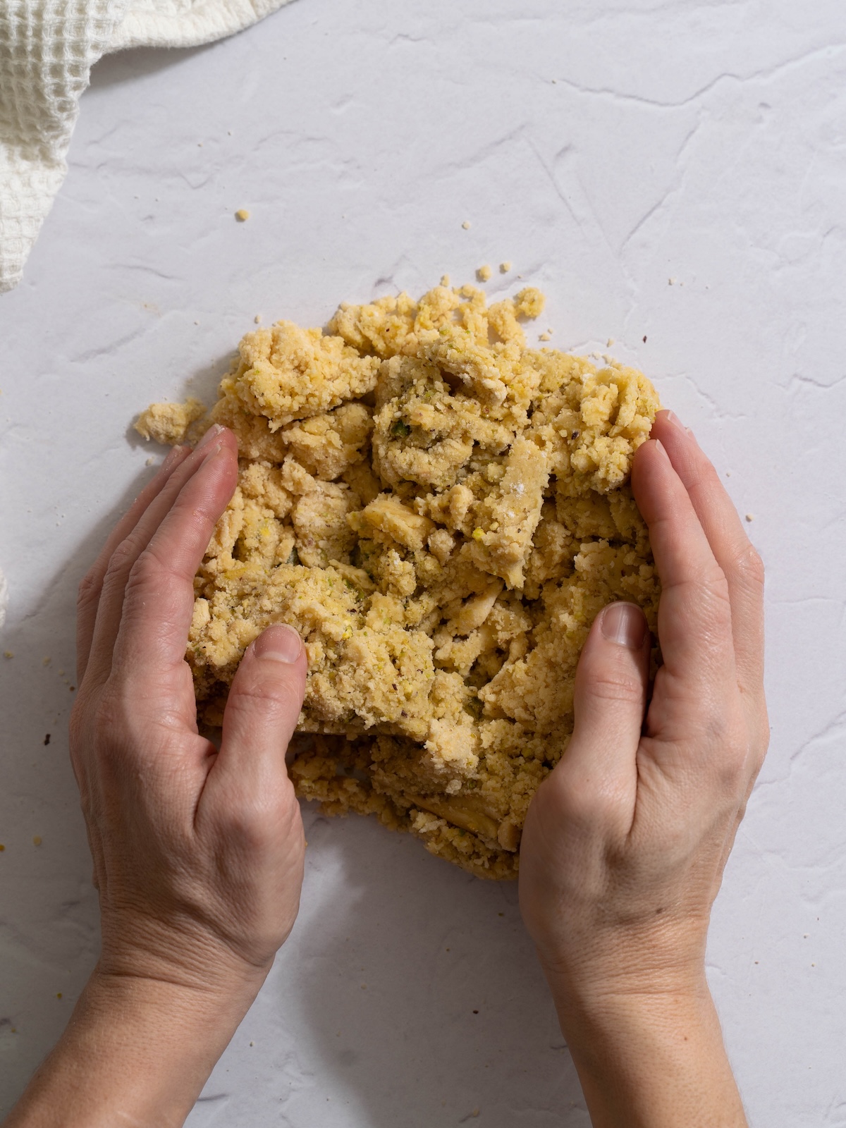 Pistachio tart dough being kneaded