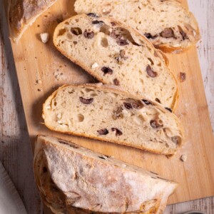 Slices of homemade sourdough bread filled with olives and feta cheese