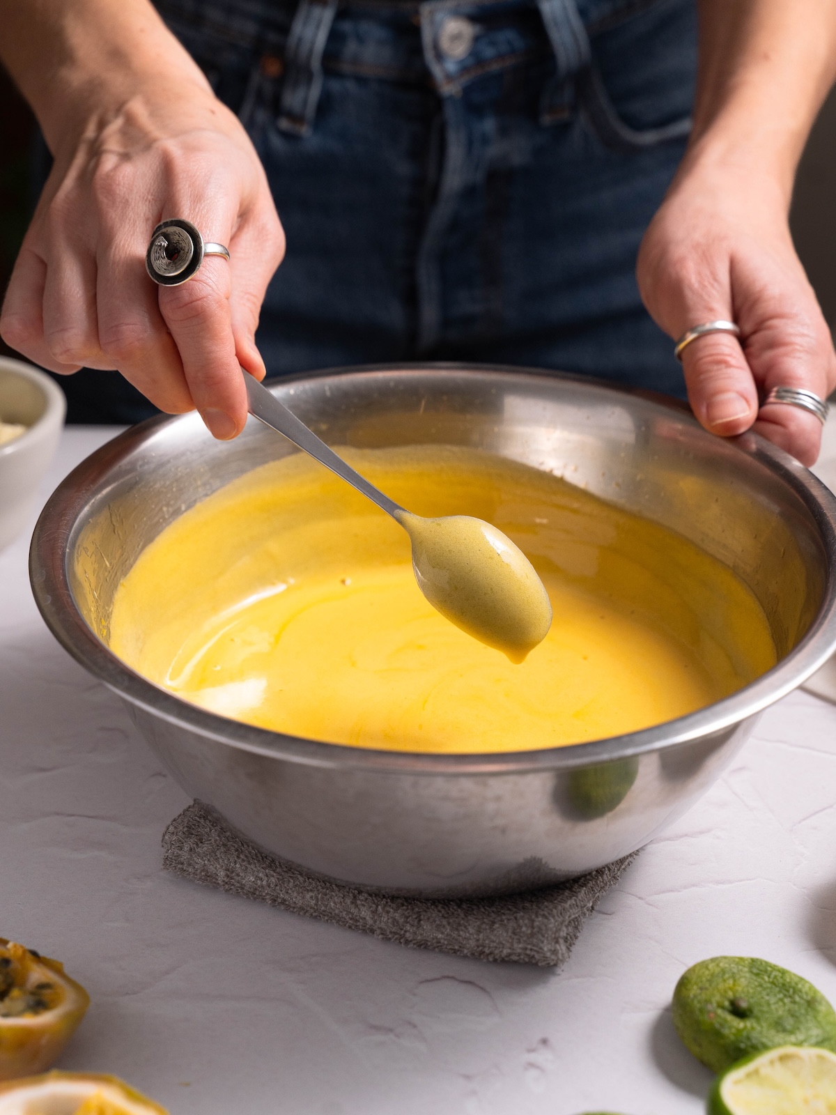 Fruit curd coating the back of a spoon