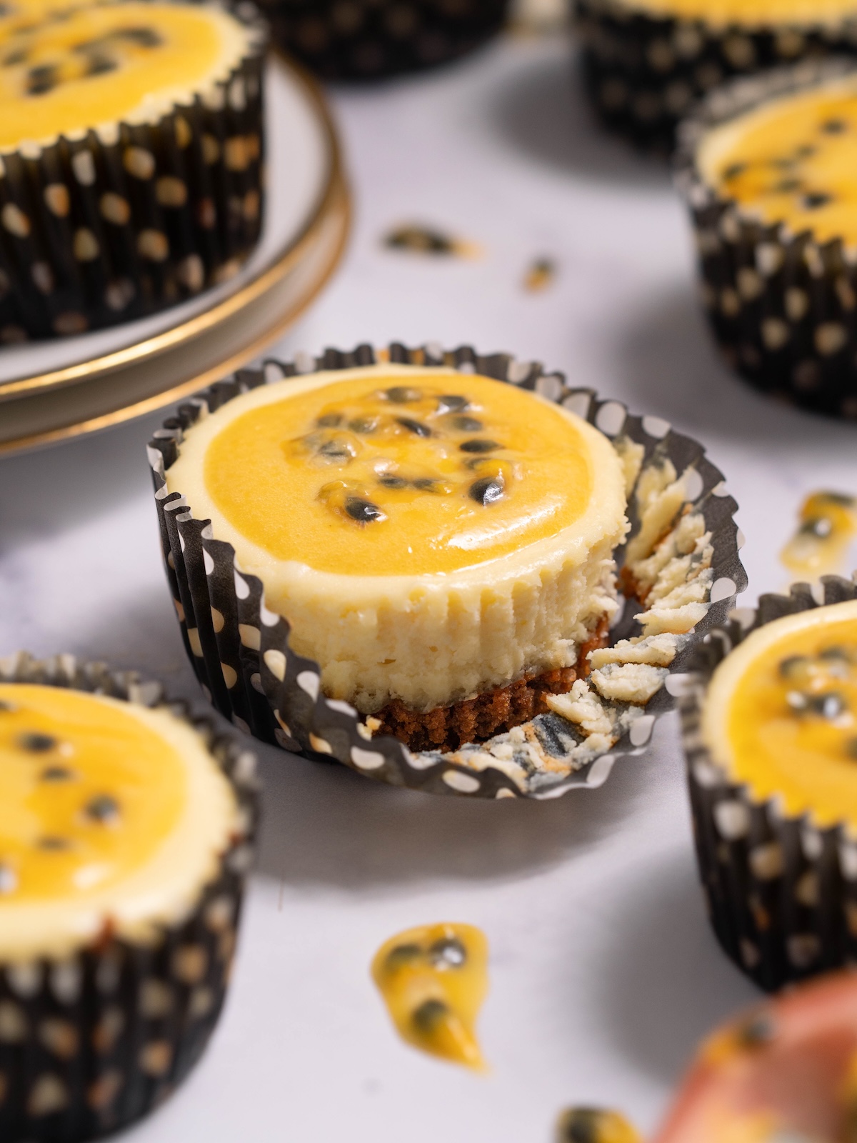 Miniature passionfruit curd cheesecakes