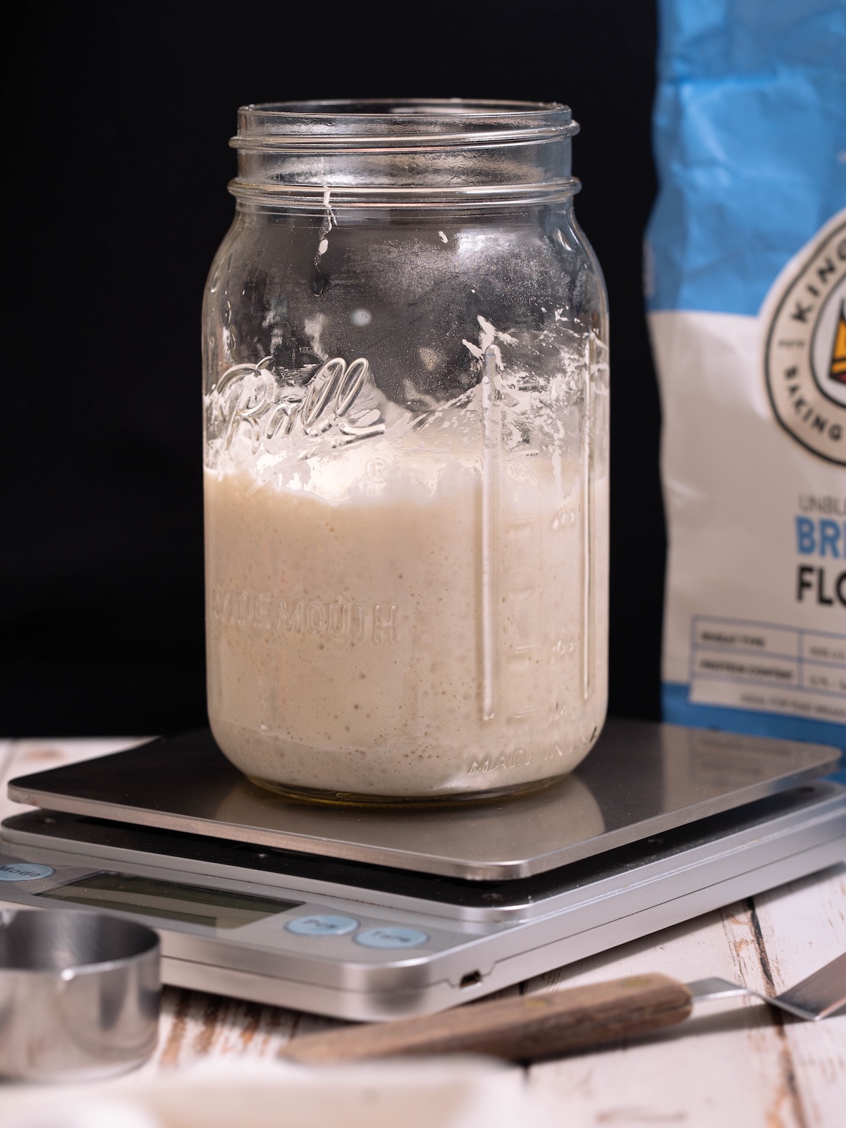 Items needed to make sourdough starter - flour, kitchen scale, jar, tools