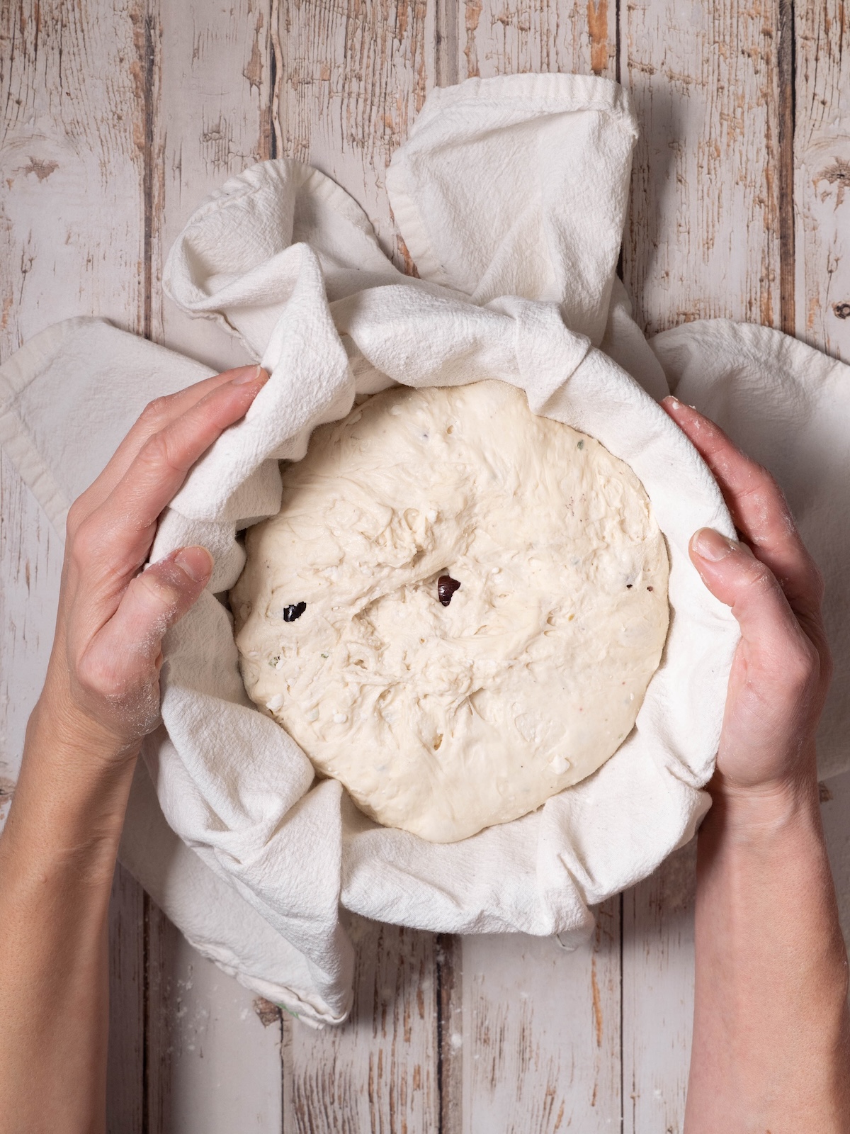Shaped sourdough in a floured bowl