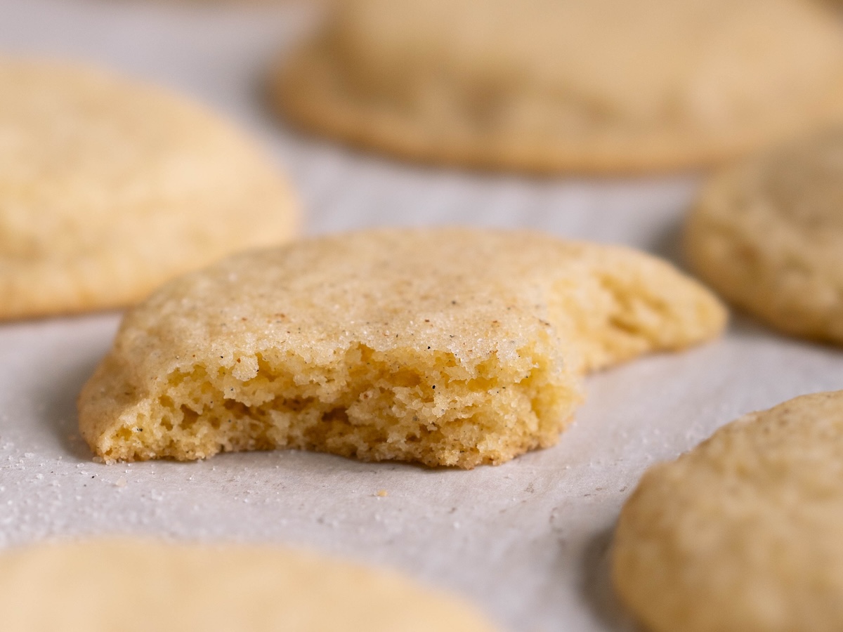 A bite taken out of a cardamom snickerdoodle