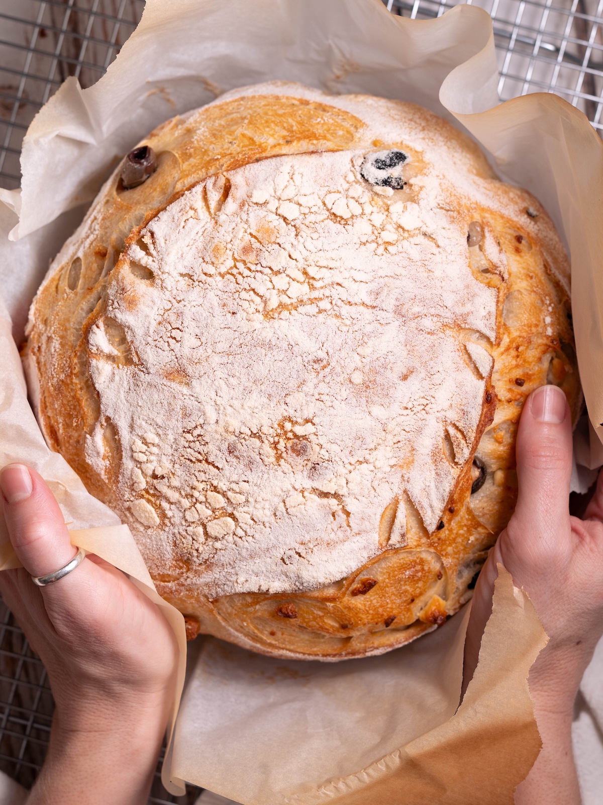 A freshly baked loaf of olive and feta sourdough bread