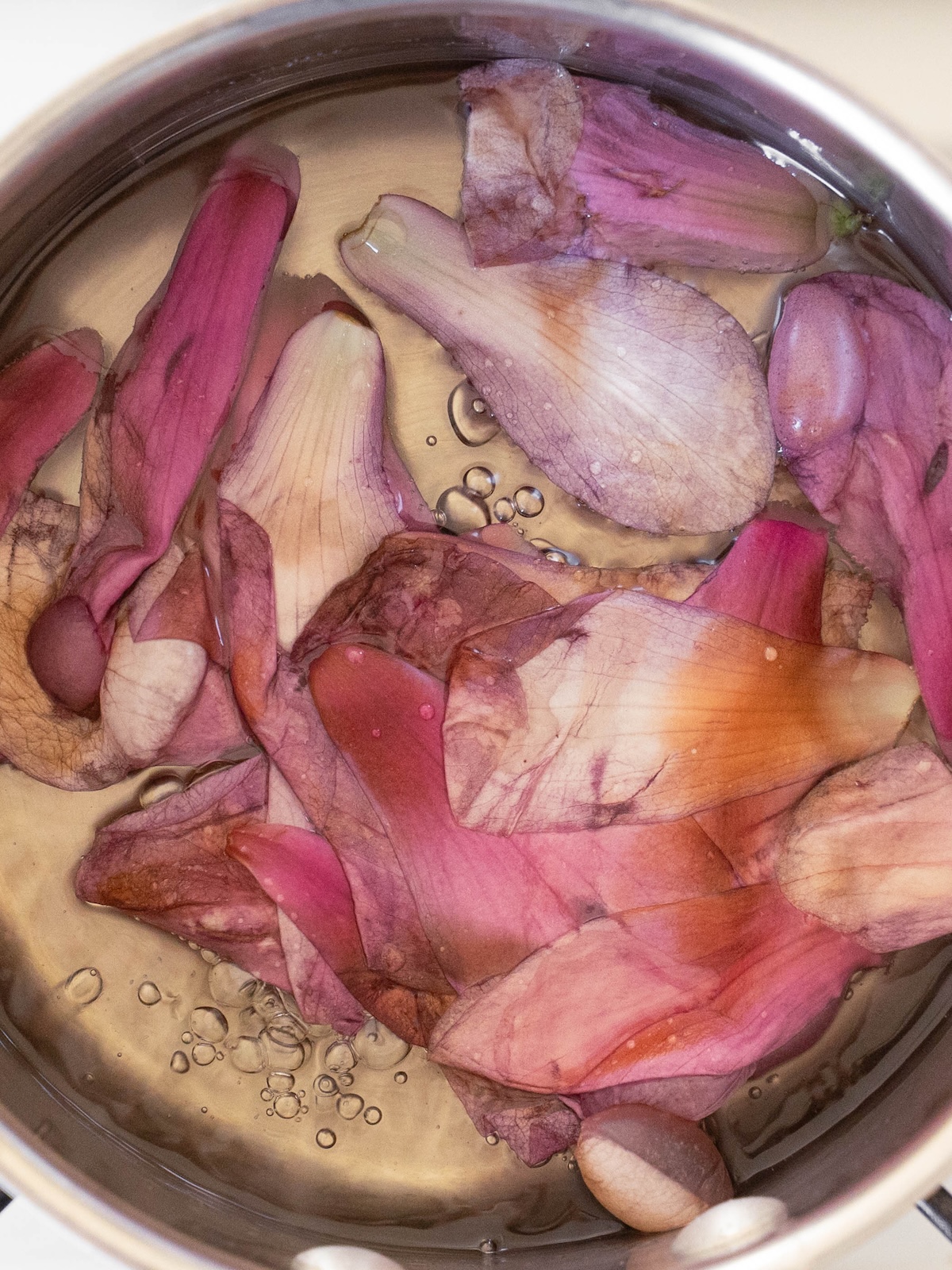 Magnolia flower petals cooking in simple syrup