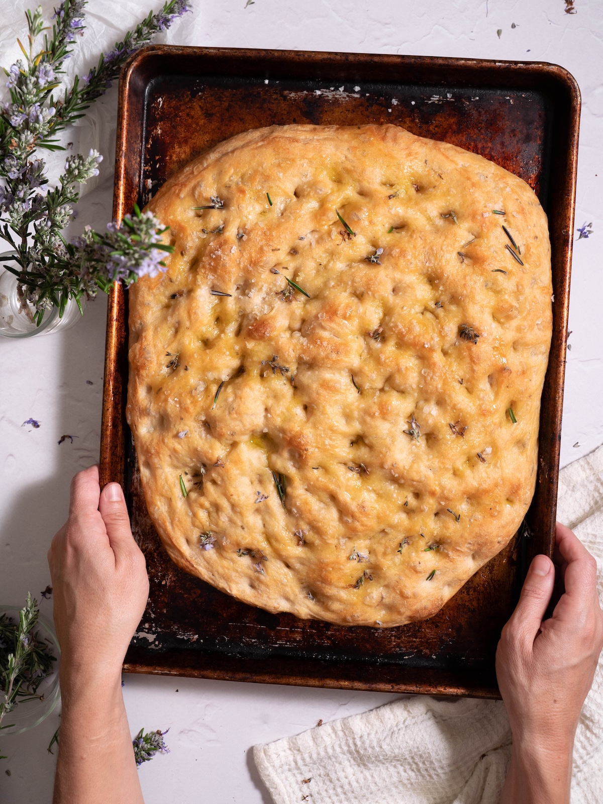Sourdough discard focaccia with rosemary flowers and sea salt