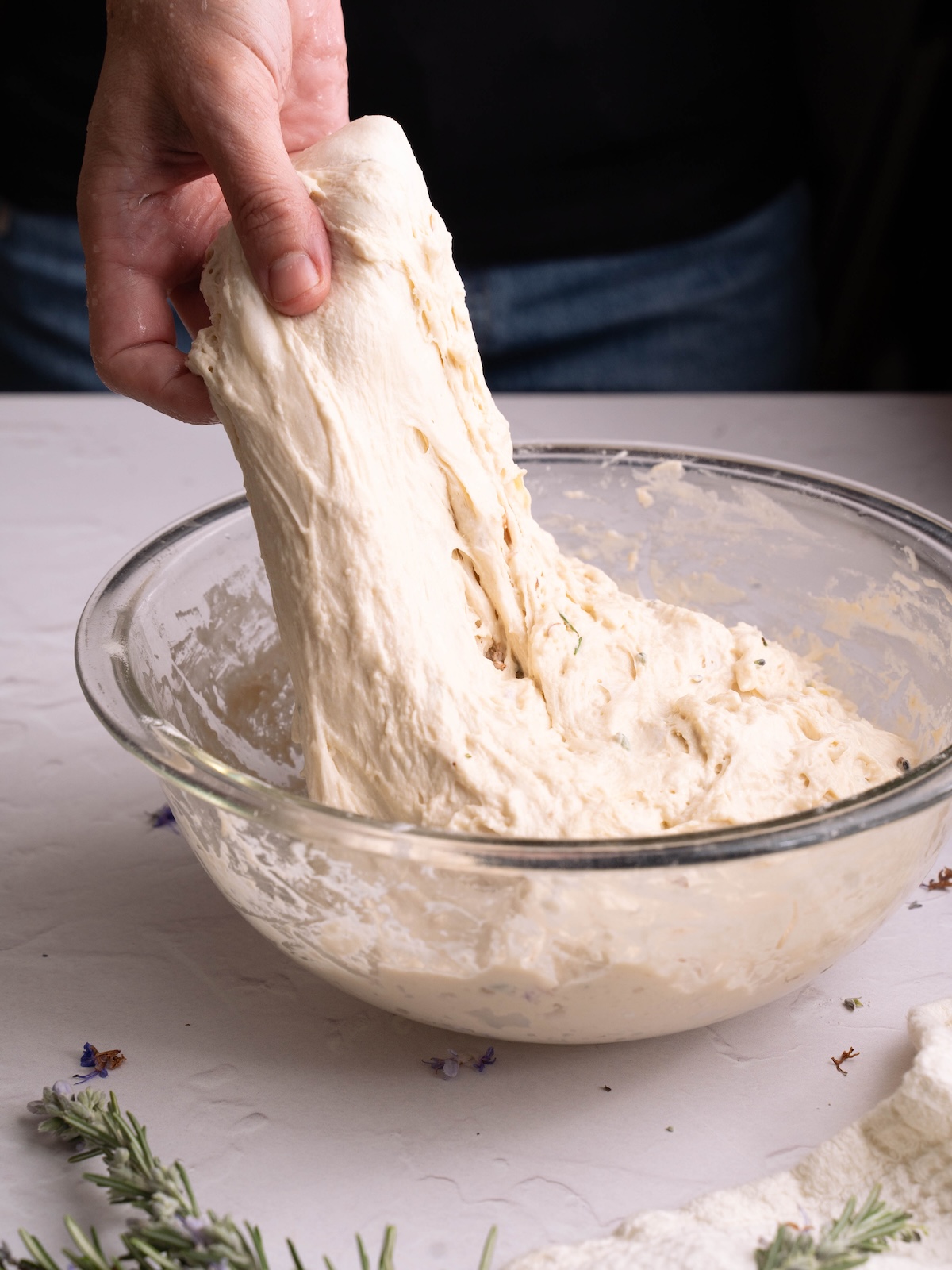 Stretching bread dough to build tension