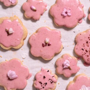 Magnolia shortbread cookies with blood orange glaze and edible flowers