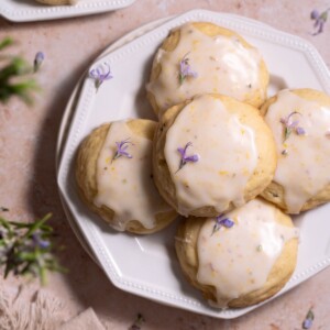 A dessert plate piled high with soft lemon rosemary flower cookies