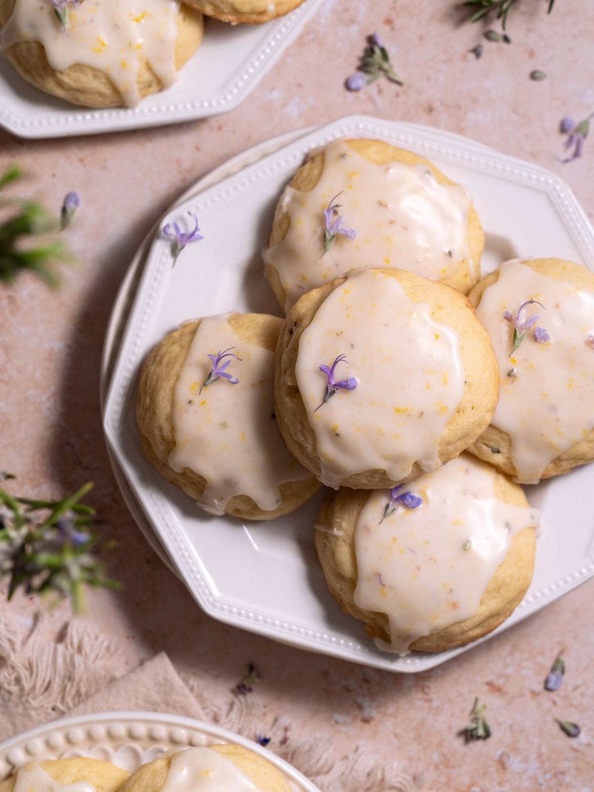 A dessert plate piled high with soft lemon rosemary flower cookies