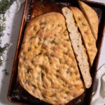 Rosemary flower sourdough discard focaccia sliced to show interior texture