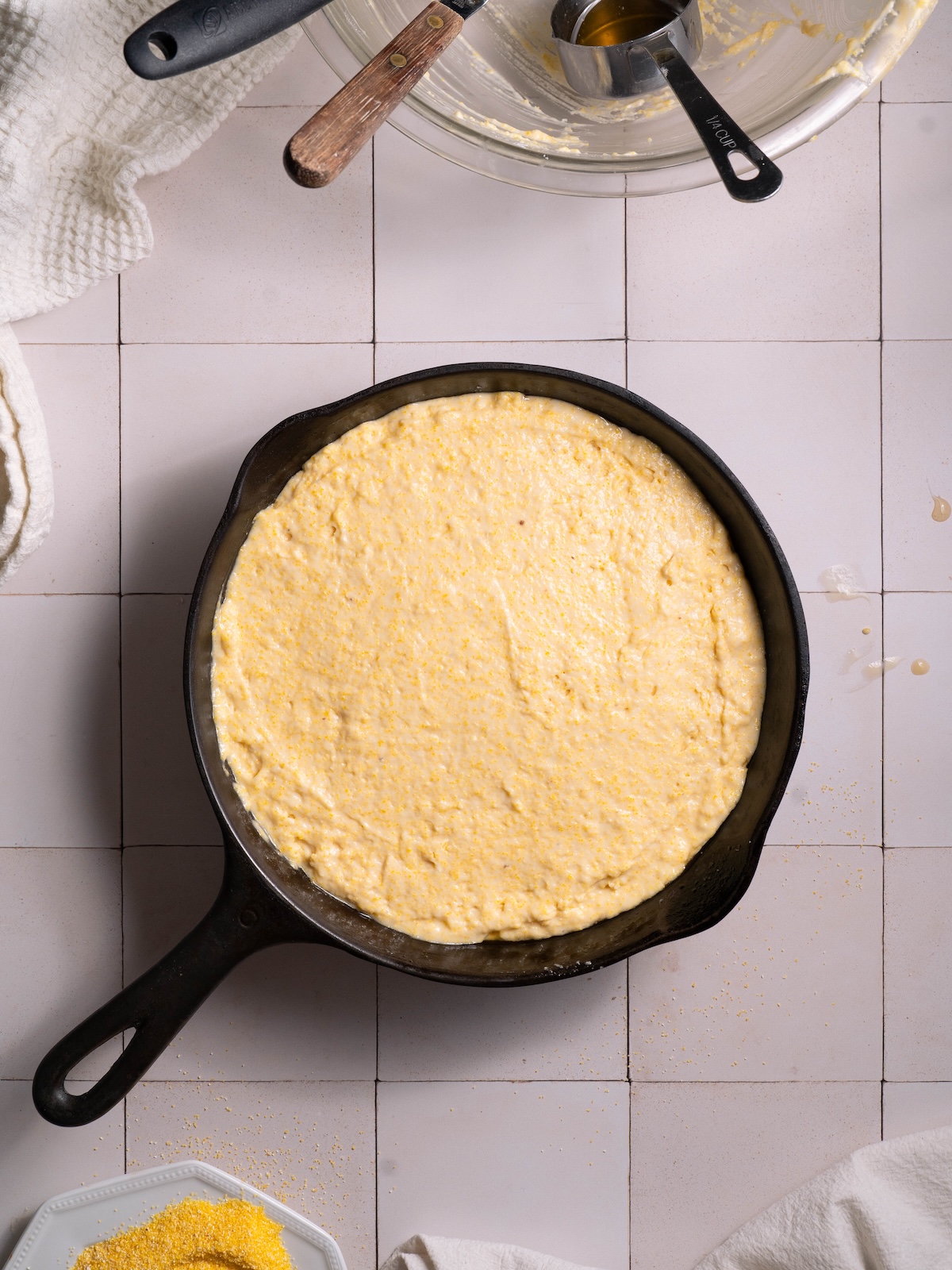 Cornbread in a cast iron pan before baking