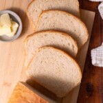Slices of sourdough sandwich bread fanned out on a cutting board