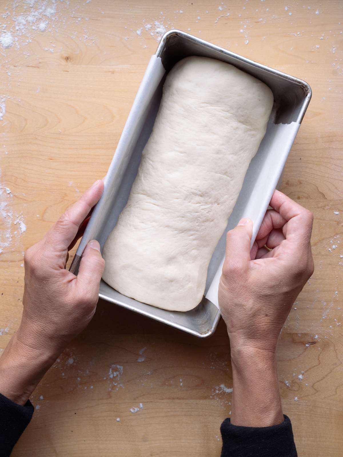 Sourdough sandwich bread dough in a loaf pan before proofing