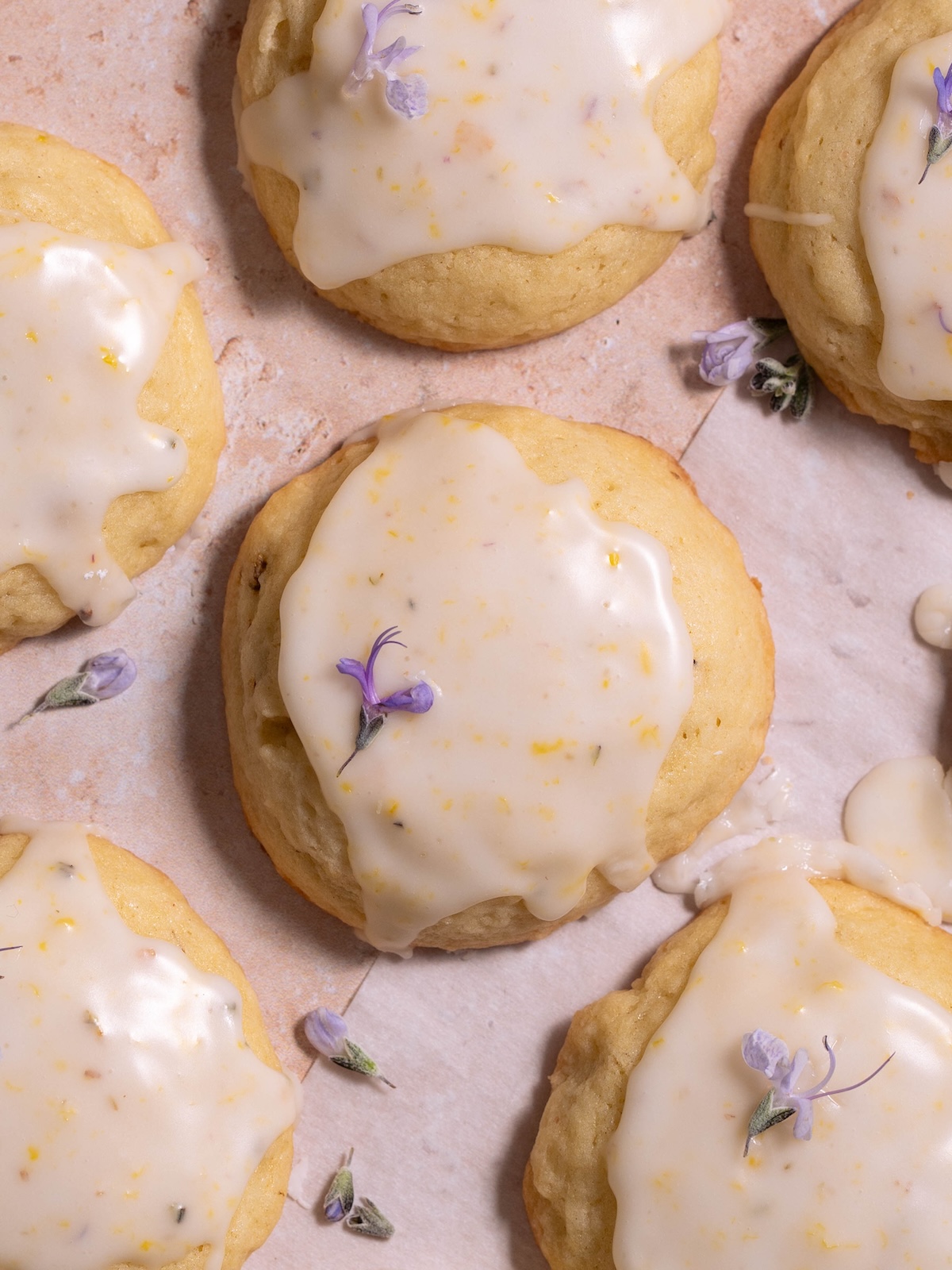 A soft lemon sugar cookie with rosemary flowers