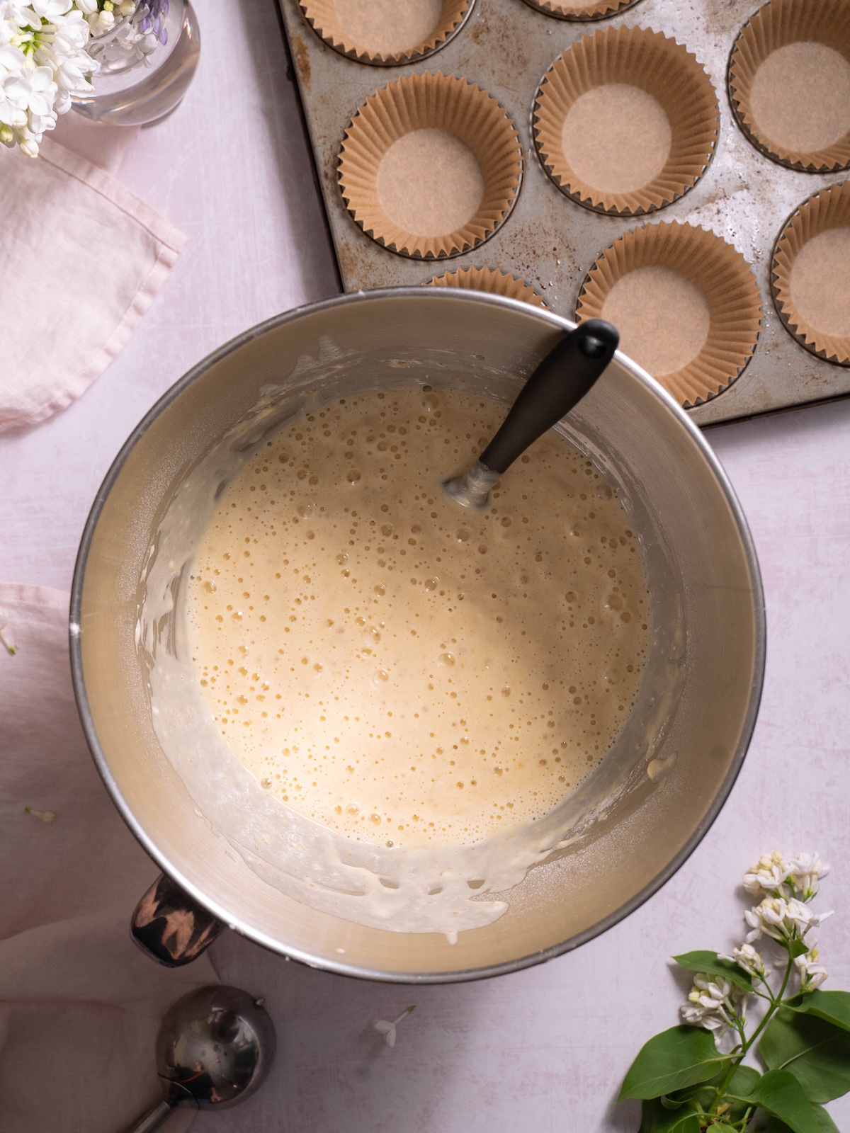 Lilac cupcake batter in a mixing bowl
