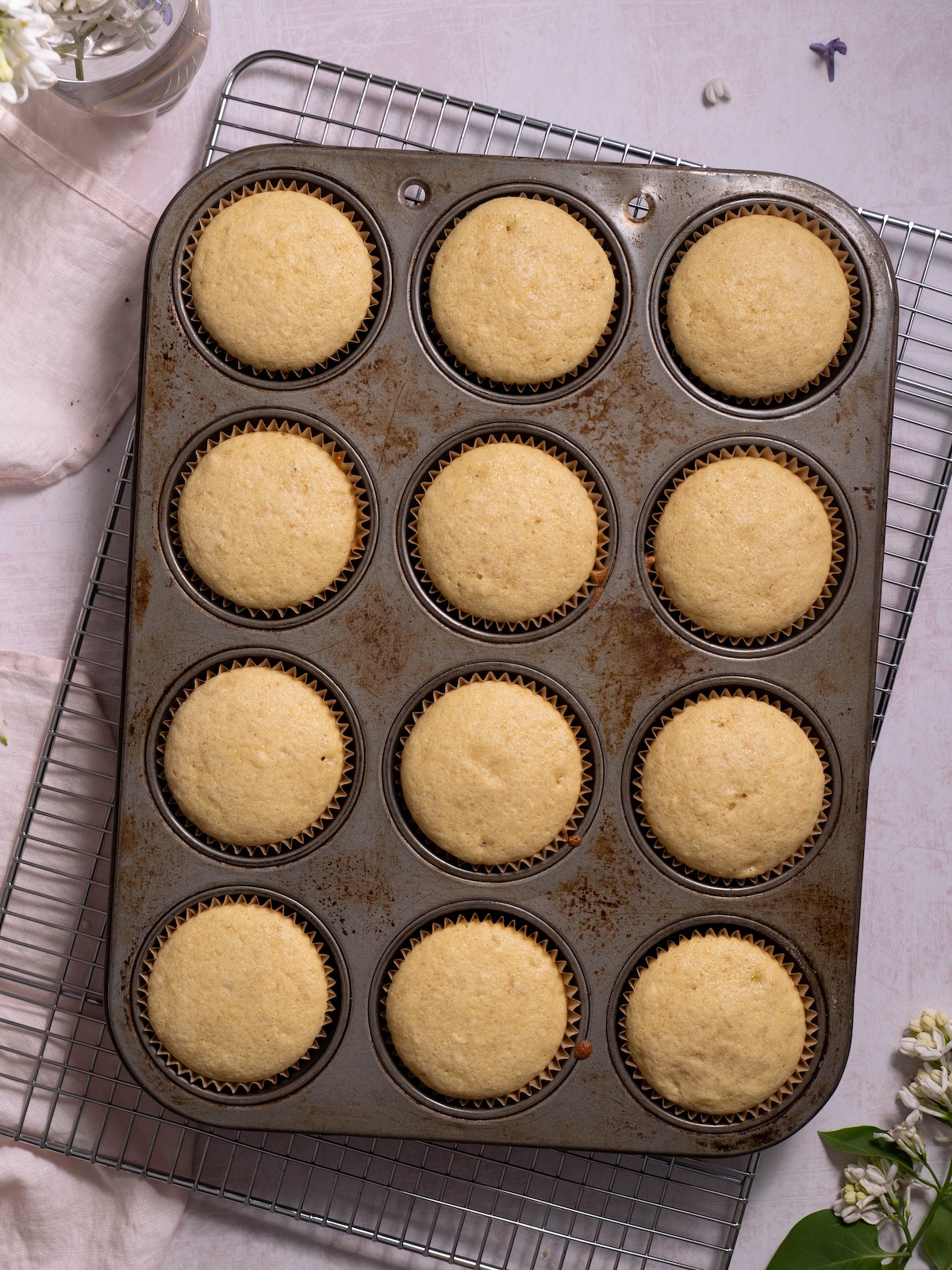 Lilac cupcakes in a cupcake tin after baking