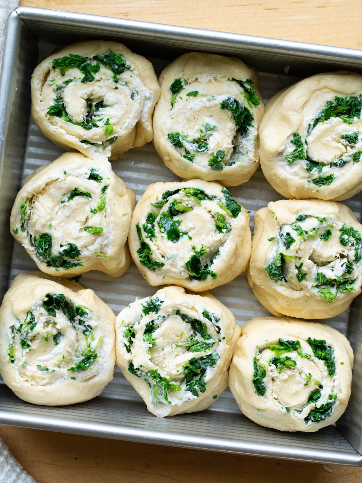 Savory nettle ricotta rolls shaped before proofing