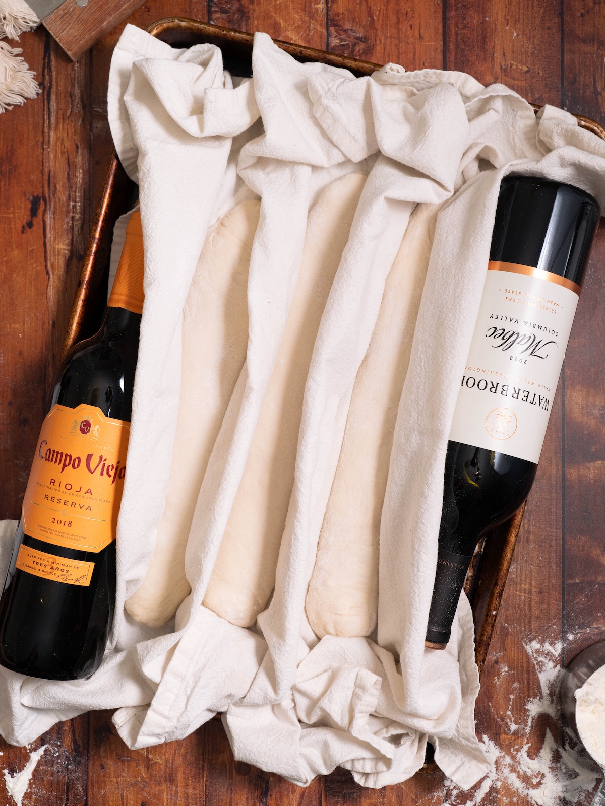 Baguettes proofing between layers of floured tea towels