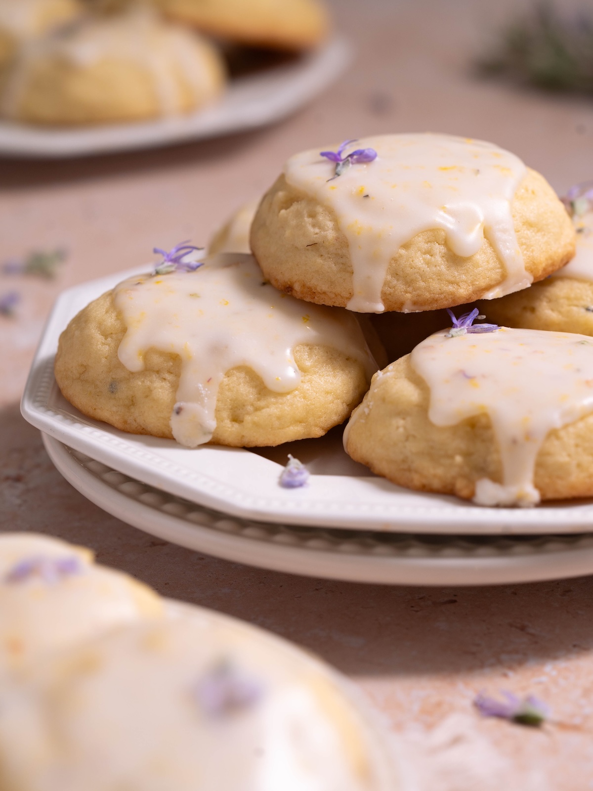 A plate full of lemon rosemary flower sugar cookies