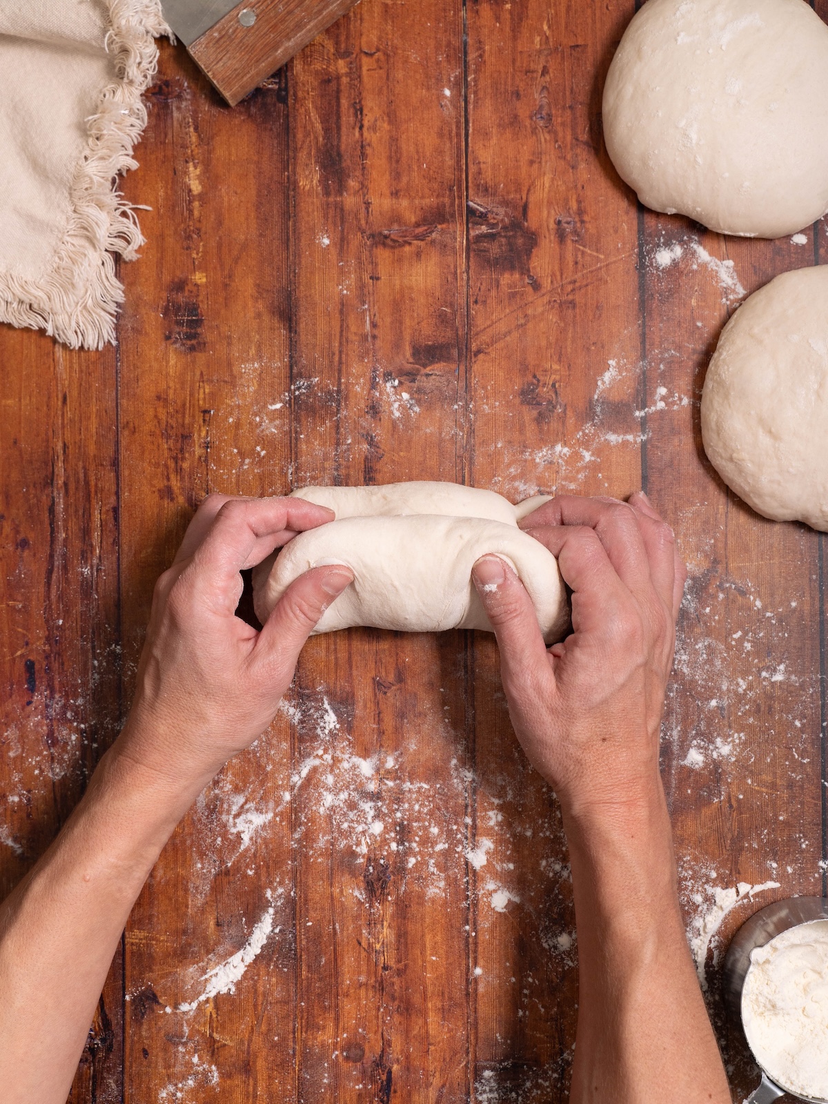 Folding bread dough in half