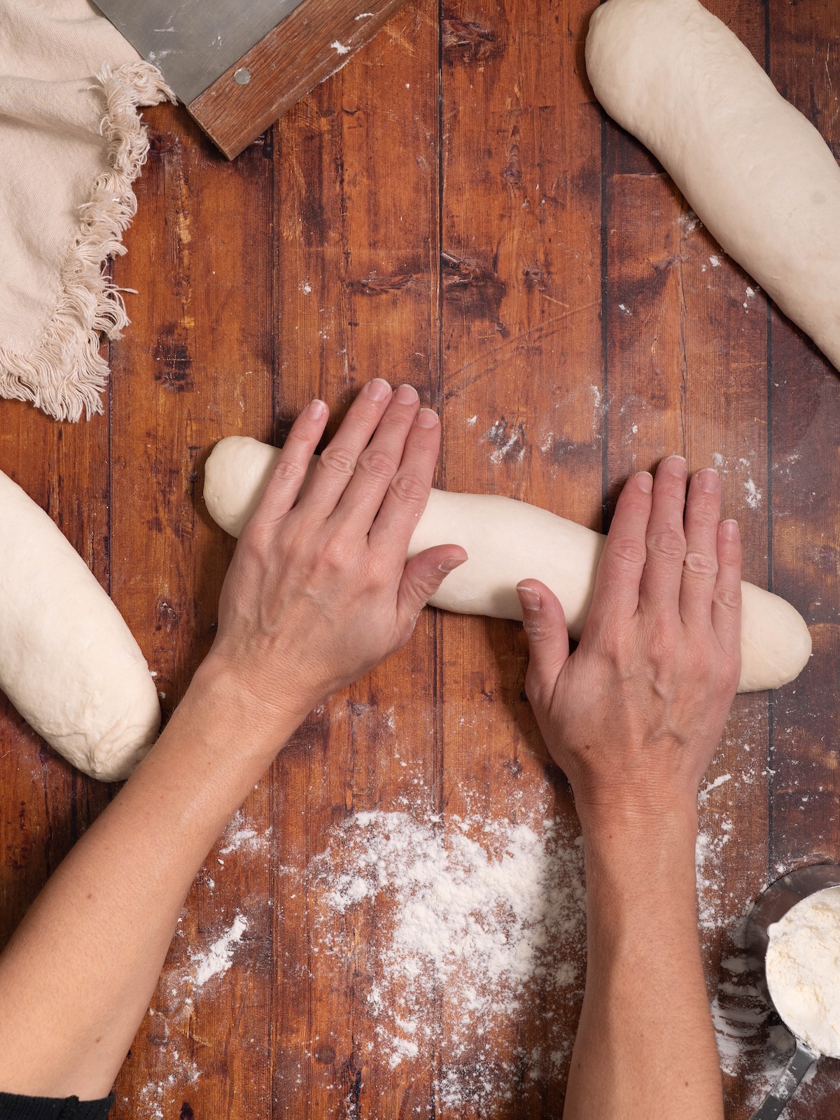 Rolling bread dough into a cylinder