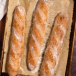 Sourdough demi baguettes on a baking sheet