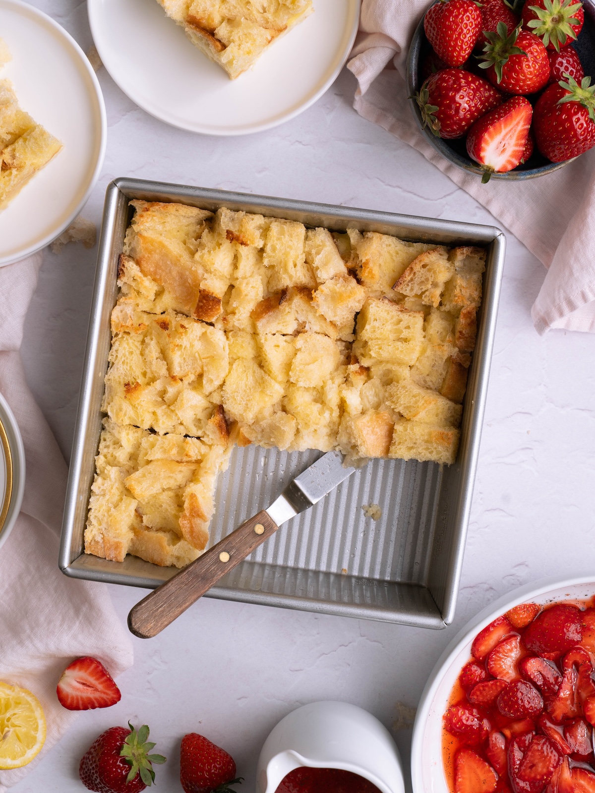 Bread pudding and a bowl of fresh strawberries
